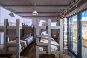 A bed or beds in a room at Mandy Luxury Villa by Cretevasion