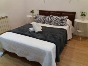 A bed or beds in a room at Casa de Huéspedes Prada