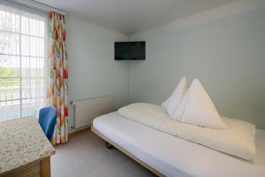 Letto o letti in una camera di Hotel Frohe Aussicht
