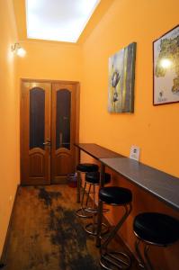 a room with a table and chairs in it at Hostel Golden Gates in Kyiv