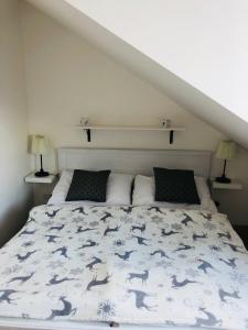 Postel nebo postele na pokoji v ubytování Útulný apartmán na Dolní Moravě