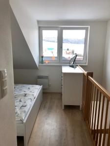 Postel nebo postele na pokoji v ubytování Útulný apartmán na Dolní Moravě