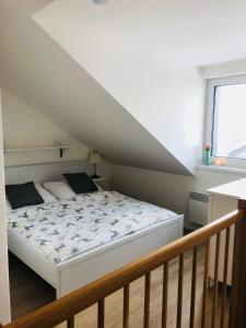 Postel nebo postele na pokoji v ubytování Útulný apartmán na Dolní Moravě