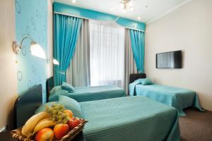 Ein Bett oder Betten in einem Zimmer der Unterkunft Nevsky Contour