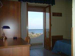 Postel nebo postele na pokoji v ubytování Hotel Il Vulcano