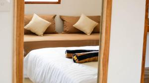 Voodi või voodid majutusasutuse Mango Lodge toas