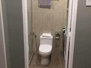 a small bathroom with a toilet and a shower at G Langkawi Motel in Kuah +11 photos