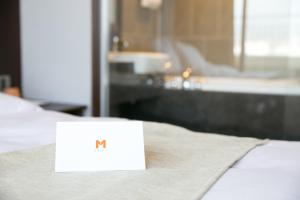 Postel nebo postele na pokoji v ubytování Mstay Hotel