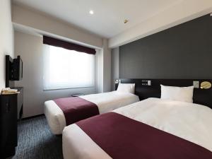Postel nebo postele na pokoji v ubytování Hotel Villa Fontaine Tokyo-Kayabacho