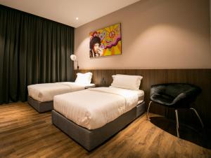 Postel nebo postele na pokoji v ubytování Eureka Hotel Penang + 15 fotografií