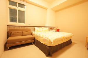 Tempat tidur dalam kamar di Com Inn-花蓮後車站電梯停車場