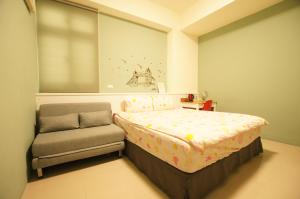 Tempat tidur dalam kamar di Com Inn-花蓮後車站電梯停車場