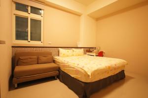 Tempat tidur dalam kamar di Com Inn-花蓮後車站電梯停車場