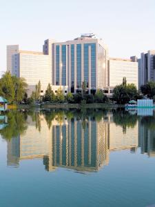 a large body of water in front of a city at AZIMUT Grand Hotel Tashkent in Tashkent
