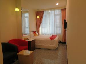 Postel nebo postele na pokoji v ubytování Sun Moon Lake Crown Yu Hotel