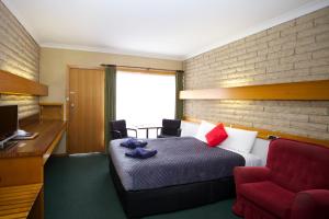 Ένα ή περισσότερα κρεβάτια σε δωμάτιο στο Glynlea Motel