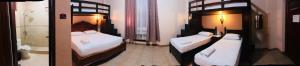 Postel nebo postele na pokoji v ubytování My Vigan Home Hotel