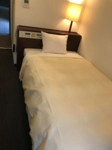 Postel nebo postele na pokoji v ubytování Hotel Tsukuba Hills Umezono