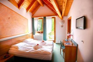 Postel nebo postele na pokoji v ubytování Hotel Fantelli