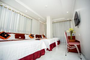 Ένα ή περισσότερα κρεβάτια σε δωμάτιο στο Van Hoa Hotel Ninh Binh +7 φωτογραφίες