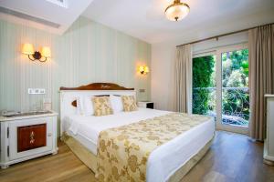 Tempat tidur dalam kamar di Joya Del Mar Hotel