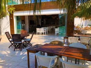 an outdoor patio with tables and chairs and a restaurant at Zest Exclusive Hotel & Spa in Ortakent