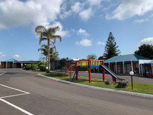 a playground on the side of a street at Cameron Thermal Motel in Tauranga