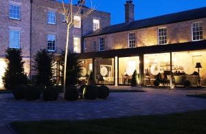 a large brick building with a lot of windows at Poets House in Ely