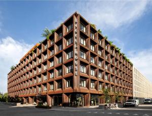 a large brown building with many windows at Steel House Copenhagen in Copenhagen