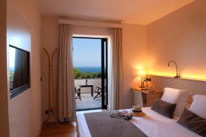 Posteľ alebo postele v izbe v ubytovaní L'Aixart Aiguablava Hotel + 37 fotografií