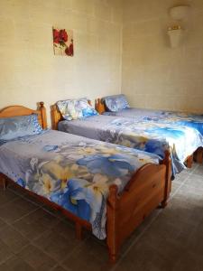 Postel nebo postele na pokoji v ubytování Ta' Karkar Villa Bed and Breakfast