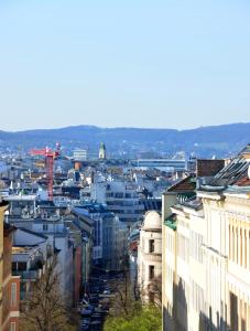 a view of a city with buildings at Spacious Flat with Panoramic View in Vienna