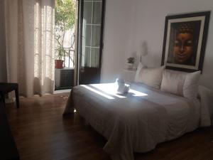 A bed or beds in a room at Casa de Huéspedes Prada