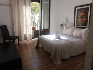 A bed or beds in a room at Casa de Huéspedes Prada