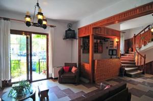 a living room with a couch and a table at Chrissafis Hotel in Panagia