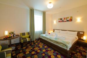 
Кровать или кровати в номере Konfor Hotel Burabay
