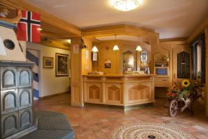 a large bathroom with a sink and a counter in a room at Albergo Bellaria in Carano