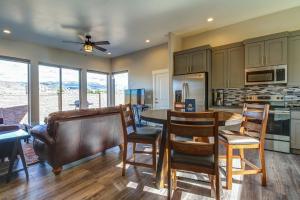 a kitchen and dining room with a table and chairs at Rim View 2 in Moab