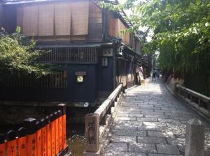 a cobblestone street in an alley with a building at Sakara Gion in Kyoto +22 photos