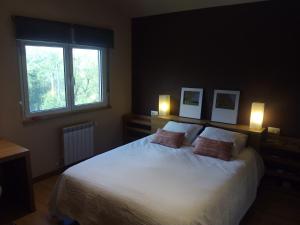 A bed or beds in a room at Villa Bosque Albite