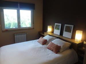 A bed or beds in a room at Villa Bosque Albite