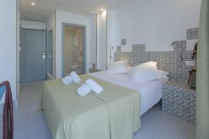 Postel nebo postele na pokoji v ubytování Hostal Gravina
