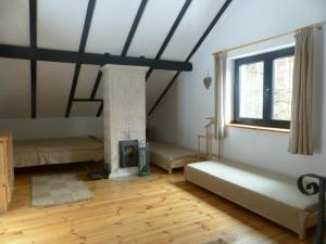a room with a room with a fireplace and a room with at Cabana Crenguta in Sibiu