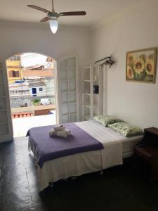 Un pat sau paturi într-o cameră la Pousada Recanto do Arraial do Cabo