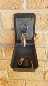 a metal box with a pair of keys in it at Alexander Drive B & B in Esperance