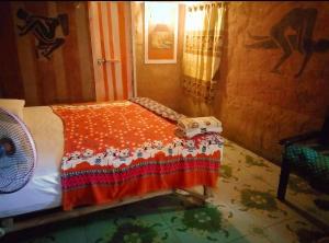Postel nebo postele na pokoji v ubytování Tiddin Resort