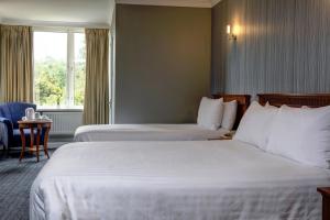 Postel nebo postele na pokoji v ubytování Best Western Thurrock Hotel