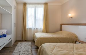 Un pat sau paturi într-o cameră la Boka di Mare