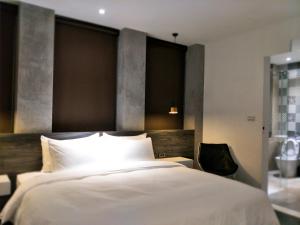 Postel nebo postele na pokoji v ubytování 小小邸 Small Hotel