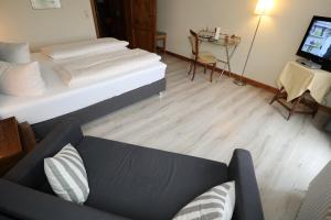Postel nebo postele na pokoji v ubytování Schwarzwaldhotel Stollen